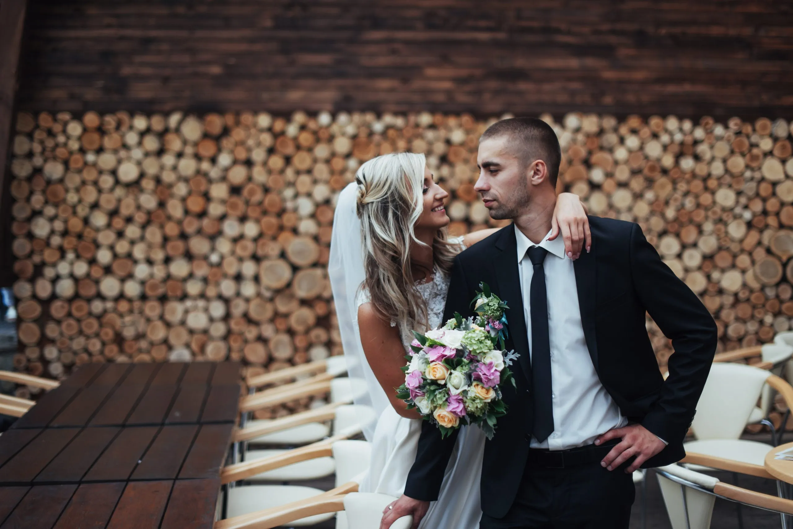 Happy young couple poses for photographers on her happiest day.
