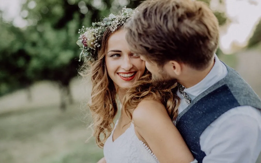 Beautiful bride and groom in green nature.