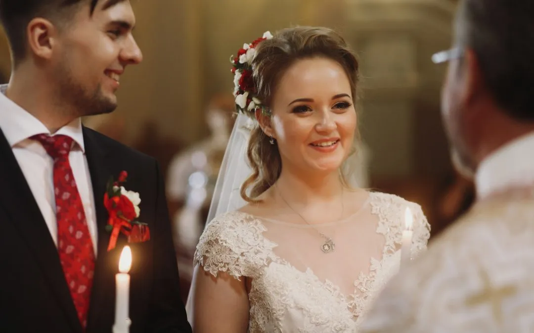 groom and bride in church during wedding ceremony,