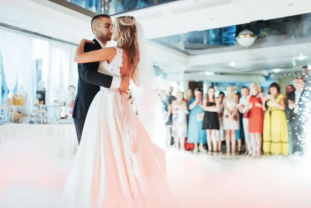 Happy bride and groom their first dance