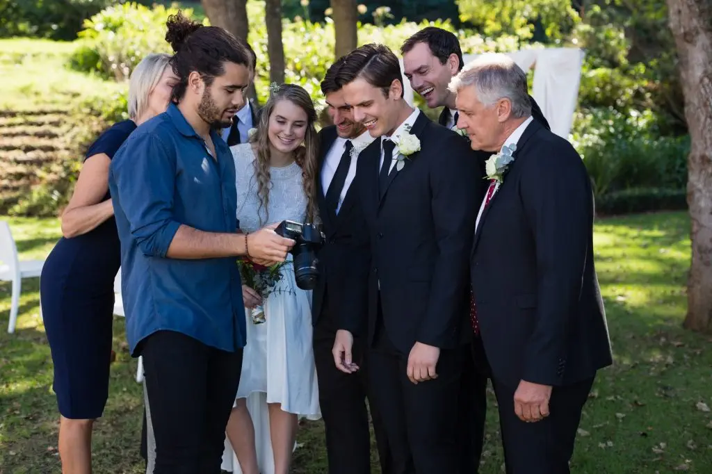 Photographer reviewing photographs on digital camera