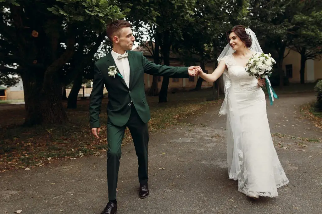 stylish luxury bride and groom running and having fun