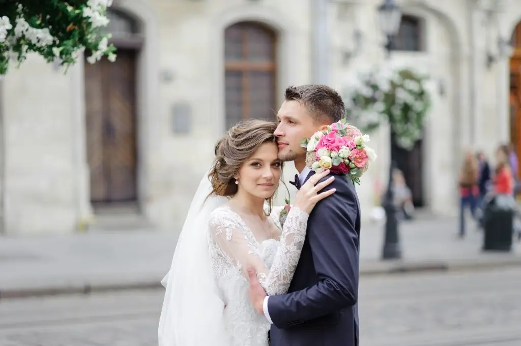 Wedding photo session of a young beautiful couple in the old city.