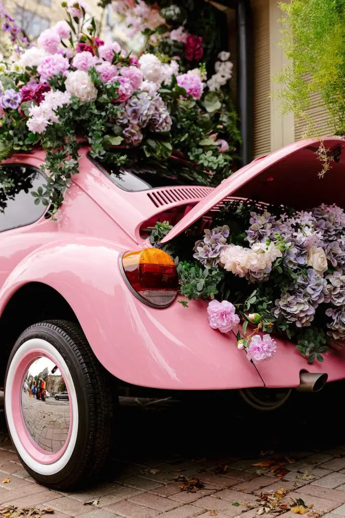 Car from fairy tale. Wedding bouquet on the car. Decoration old car