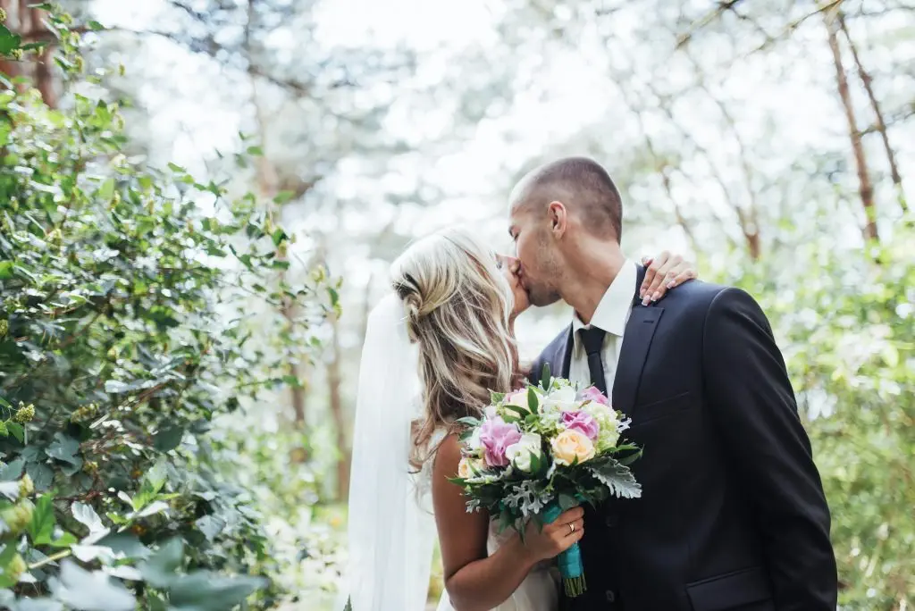 Happy young couple poses for photographers on her happiest day.