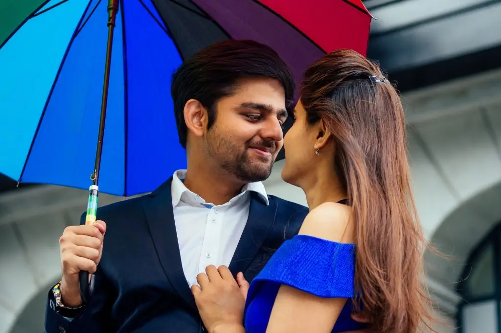 indian woman in long evening blue dress spinding romantic time together with lover handsome