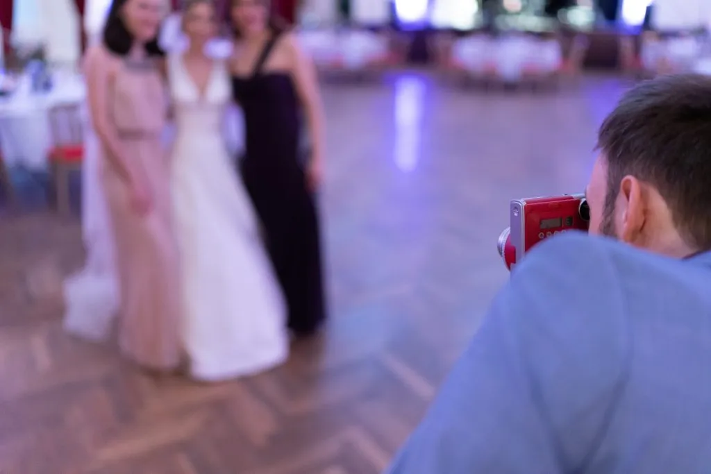 Wedding guest taking picture with Camera