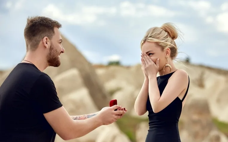 Man makes a marriage proposal to his girlfriend. Engagement of a couple in love