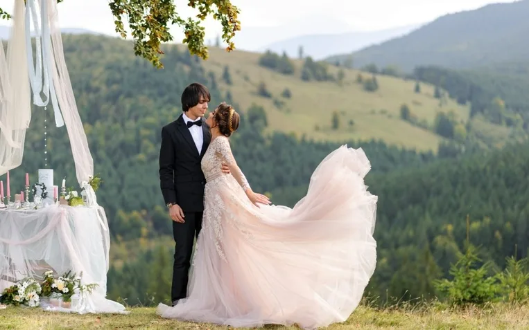 Wedding photo in the mountains. Wedding ceremony in the woods
